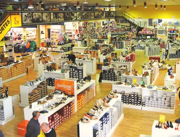 Rows of shoes on display in the factory outlet